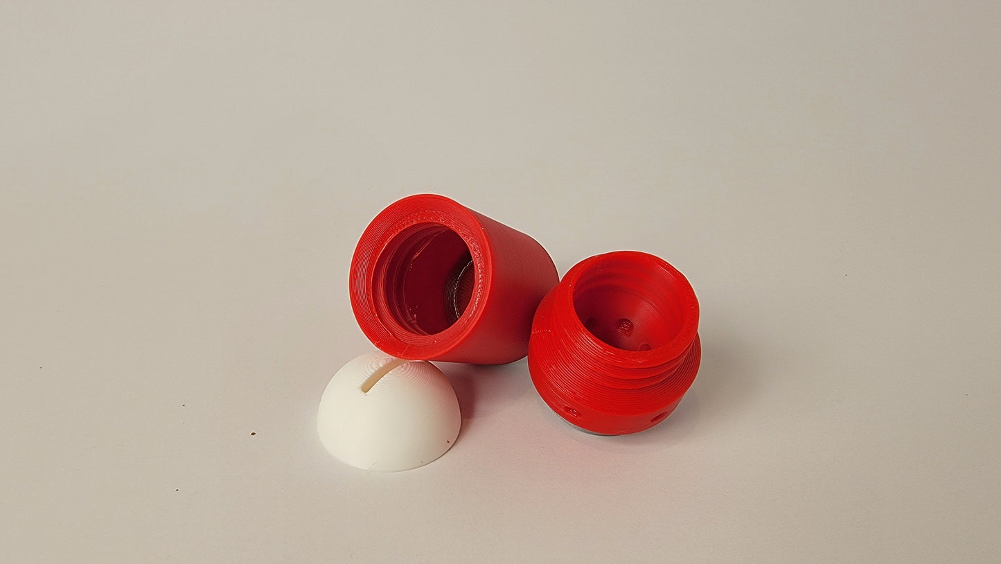 Close-up of small pop can hide opening for scent detection training